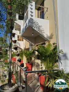 a building with plants on the side of it at Jade Mountain Suites, Jarabacoa in Jarabacoa