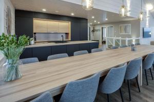 a large dining room with a large wooden table and chairs at Luxury Villa Himos Hillside in Himos