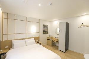 Letto o letti in una camera di Aank Hotel Daejeon Yuseong 1st