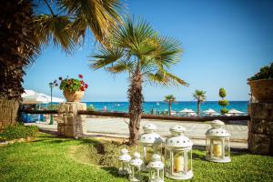 a row of lights in front of the beach at Hotel Paralio in Possidi