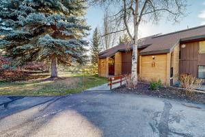 a house with a tree and a driveway at The Silver Saddle in Ketchum