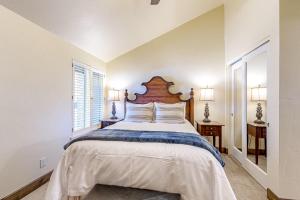 a bedroom with a large bed with a wooden headboard at The Silver Saddle in Ketchum