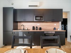 Kuchyň nebo kuchyňský kout v ubytování La Bastide de Saint Barnabé - Jacuzzi Terrasse Clim Wifi Parking Petanque