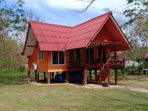 a house with a red roof at Bang Yan Rimlay in Ko Yao Noi