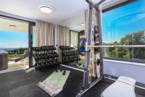 an image of a gym with a large window at Deluxe villa with heated pool, whirpool, sea view near beautiful beach III - by Traveler tourist agency Krk ID 2402 in Krk