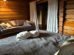 a bed with two white pillows on it in a bedroom at "SoFly Lodge", Charm and Elegance in Noresund