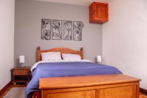 Ein Bett oder Betten in einem Zimmer der Unterkunft Casa com banheira no centro de Campos do Jordao SP