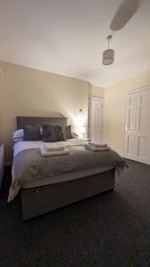 a bedroom with a large bed in a room at The Cosy Beech in Lisnaskea