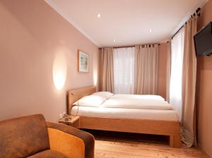 Posteľ alebo postele v izbe v ubytovaní Altstadthotel Kasererbräu