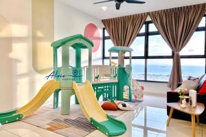 a childrens play room with a slide at Atlantis Melaka I 5-11pax I 5min JonkerSt By Alviv Management in Melaka