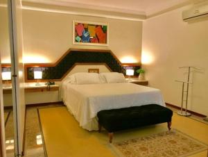 Postel nebo postele na pokoji v ubytování Cedro Hotel