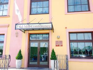 a building with a sign that reads old mill conference at Old Mill Conference in Klaipėda