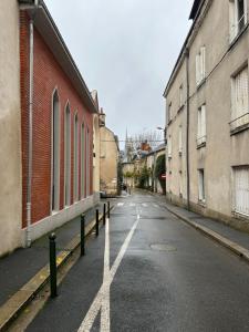 an empty street with a x painted on the road at Appartement Haut Standing in Orléans