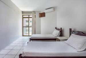 Postel nebo postele na pokoji v ubytování Apart Hotel Porto Príncipe + 37 fotografií