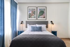 Una cama o camas en una habitación de AmazINN Places La Condesa Roma