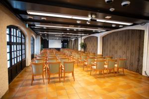 a row of chairs in a room with a screen at Stryn Hotel in Stryn