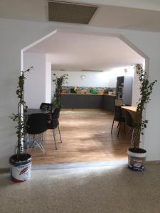 a living room with a table and chairs and a kitchen at Urban rest zone and coworking in Arrecife