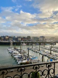 a group of boats docked in a harbor at Duchesse de Berry - Vue sur port in Dieppe