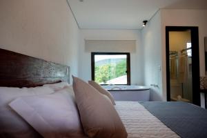 Cama ou camas em um quarto em Pousada Rancho Soberbo, Serra do Cipó