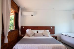 Cama ou camas em um quarto em Pousada Rancho Soberbo, Serra do Cipó