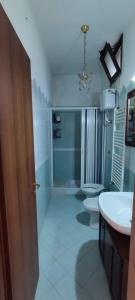 a bathroom with two toilets and a sink at casa vacanze “Tra cielo e mare” Agerola in Agerola