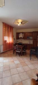 a living room with a table and a pool table at casa vacanze “Tra cielo e mare” Agerola in Agerola