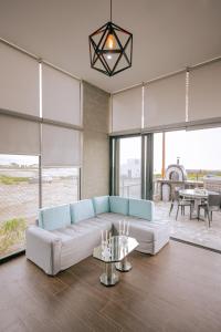a living room with a couch and a table at Mar y campo Casa Huarca in La Isla