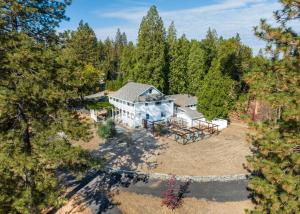 an aerial view of a house in the woods at Inn at Sugar Pine Ranch in Groveland