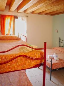 a bedroom with two bunk beds and a window at Quadrifoglio Relax in San Donà di Piave