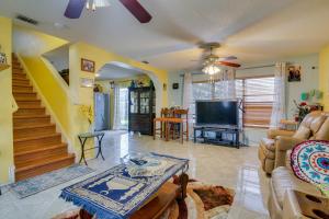 a living room with a couch and a tv at McAllen Vacation Rental Less Than 10 Mi to La Plaza Mall! in McAllen