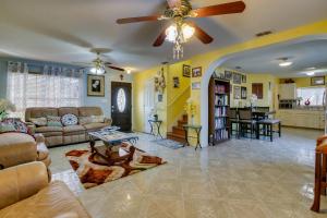 a living room with a couch and a ceiling fan at McAllen Vacation Rental Less Than 10 Mi to La Plaza Mall! in McAllen