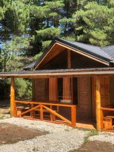 a house with a solar roof on top of it at Brisa del Bosque in El Bolsón +27 photos