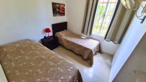 Voodi või voodid majutusasutuse Complejo Cabañas Piriápolis toas