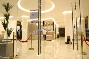 a store lobby with a man standing in a store at روز نجد للشقق الفندقية in Riyadh