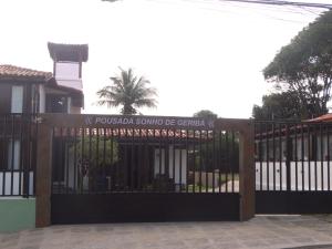 a gate in front of a house at Pousada Sonho de Geribá in Búzios