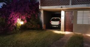 a car parked in a garage next to a garage door at La Isla - Araminda in Araminda