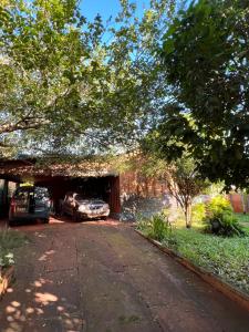 a garage with two cars parked in a driveway at Dorbozy in Wanda