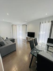 a living room with a couch and a table at Apartamento luminoso cerca Salera in Castellón de la Plana