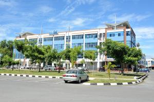a car parked in front of a building at Inn86 in Bintulu