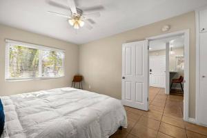 a bedroom with a bed and a ceiling fan at Brand New Apartment Close to Beach and Downtown in Santa Barbara