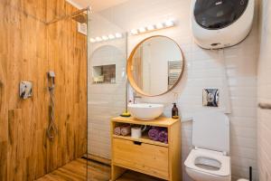 a bathroom with a sink and a mirror at Hanul Anei - entire property in Braşov