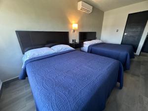 Postel nebo postele na pokoji v ubytování FIESTA MIRAMAR
