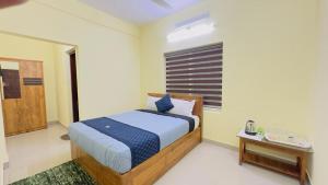 Katil atau katil-katil dalam bilik di Mystique Inn Wayanad