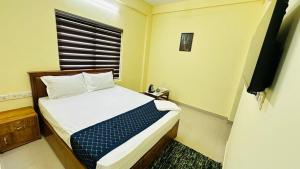 Katil atau katil-katil dalam bilik di Mystique Inn Wayanad