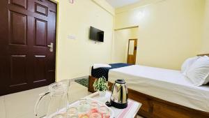Katil atau katil-katil dalam bilik di Mystique Inn Wayanad