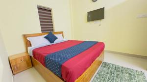 Katil atau katil-katil dalam bilik di Mystique Inn Wayanad