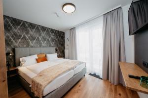 Säng eller sängar i ett rum på Hotel Brückenwirt