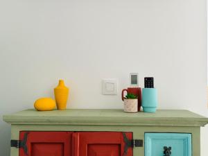 a shelf with vases and other items on it at Villa Don Paco in Las Negras