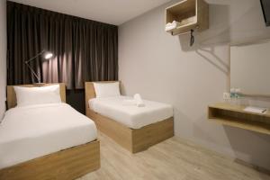 Postel nebo postele na pokoji v ubytování Vio Hotel