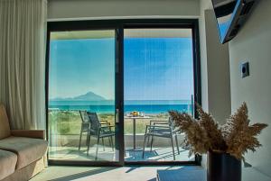 a living room with a view of the ocean at Onar Sarti Luxury Living in Sarti